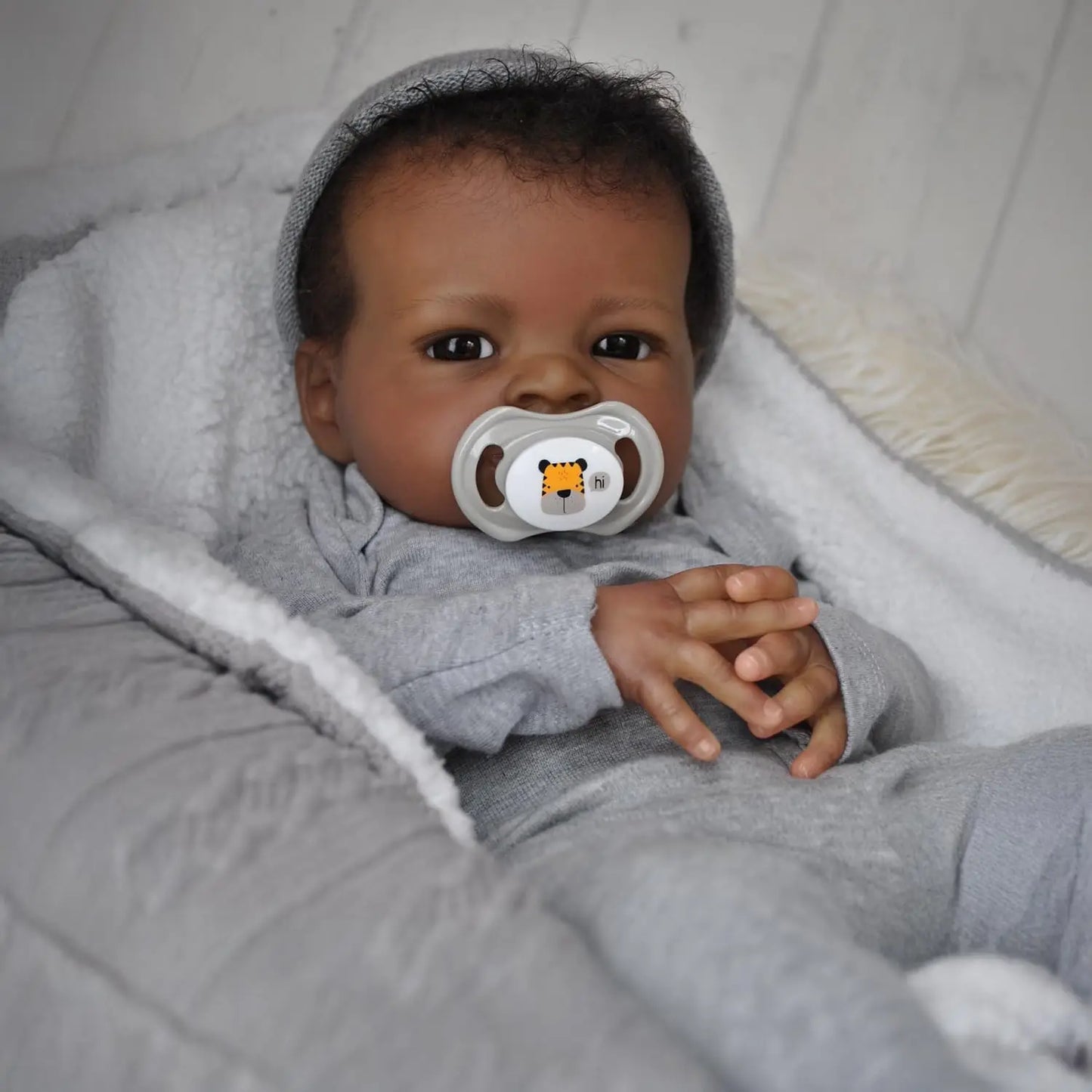 Realistic Reborn Baby Doll, 19-Inch African American Lifelike Boy | Real-Life Feel, Hand-Rooted Hair, Handmade Newborn, Weighted Body, Soft & Cuddly, Accessories Included, Gift Box,Ages 3+